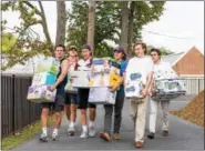  ?? SUBMITTED PHOTO ?? Hill School students carry donations for victims of Hurricane Maria to be loaded onto a bus and shipped to Puerto Rico.