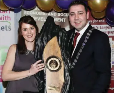  ??  ?? Then Cork County Mayor councillor John Paul O’Shea presenting the Duhallow Business of the Year Award 2015 to Mary Murphy, manager of Banteer Childcare Centre, at the awards ceremony at the James O’Keeffe Institute, Newmarket.