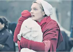  ??  ?? Lifesaver: Elisabeth Moss stars as Offred in ‘The Handmaid’s Tale’