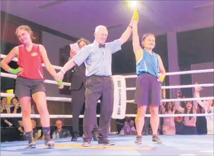  ??  ?? BLUE CHEER: Emma Sun’s supporters celebrate after she was given the nod over Emma Maaka at the Charity Boxing Event at Te Ahu on Saturday.