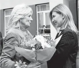  ?? SUSAN WALSH/AP ?? First lady Jill Biden visits Olena Zelenska, wife of Volodymyr Zelenskyy, outside a school Sunday in Uzhhorod.