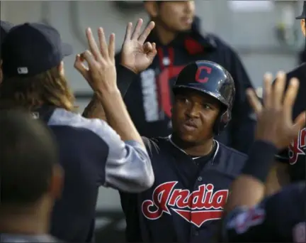  ?? CHARLES REX ARBOGAST — THE ASSOCIATED PRESS ?? The Indians’ Jose Ramirez celebrates in the dugout after scoring on a single by Yan Gomes during the fourth inning.