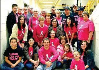  ?? PHOTO COURTESY SHELLEY WILLIAMS ?? Tracy Tice, seated and wearing a tie-dyed shirt, Tice fundraiser in Prairie Grove on Feb. 5.is surrounded by family members during a Pink Out for Tracy