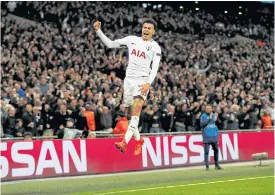  ??  ?? Tottenham’s Dele Alli jumps for joy after scoring against Real Madrid.