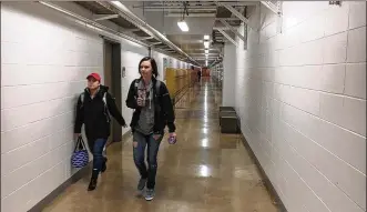  ?? CHUCK HAMLIN PHOTOS / STAFF ?? Students walk through Wright State University’s tunnels when the weather outside is hard to stand and they still have to get to class.