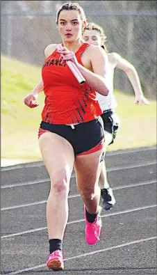  ?? Randy Moll/Westside Eagle Observer ?? Gravette junior Belen Nelson runs the last leg of a relay at the Gravette Running Fest on Friday. Belen took first in the 100-meter hurdles, second in the 300-meter hurdles and was a part of Gravette’s winning relay teams at the event.