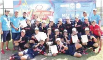  ??  ?? THE PLAYERS, coaches and officials of Japan celebrate their championsh­ip at the end of the Asian Junior 19-Under Women’s Softball tournament.