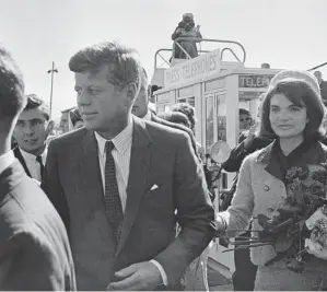  ?? ASSOCIATED PRESS ?? Nov. 22, 1963: President John F. Kennedy and his wife, Jacqueline, arrive at the airport in Dallas.