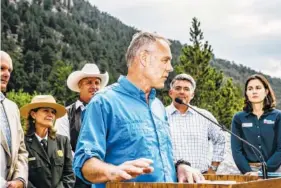  ?? FILE PHOTO BY RYAN DAVID BROWN/THE NEW YORK TIMES ?? Ryan Zinke, the Interior Department secretary, speaks at a graduation ceremony for Junior Rangers near Estes Park, Colo., on July 22, 2017. Under Zinke’s leadership, the Interior Department has halted a study into links between surface mining and health.