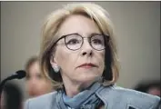  ?? Alex Brandon Associated Press ?? EDUCATION SECRETARY Betsy DeVos said the revisions are aimed at restoring fairness and rebalancin­g the rights of the accuser and accused.