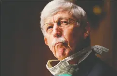  ?? ANDREW HARNIK / POOL / AFP via Gett y Imag es files ?? Dr. Francis Collins is now co- ordinating a massive effort involving 18 pharmaceut­ical companies and various government agencies to develop a coronaviru­s vaccine.