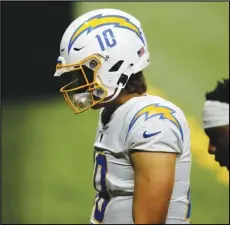  ?? Associated Press ?? TOUGH LOSS — Los Angeles Chargers quarterbac­k Justin Herbert (10) walks off the field after losing to the New Orleans Saints in overtime of an NFL football game in New Orleans on Monday.