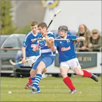  ??  ?? Newtonmore’s Glen Mackintosh shields the ball from Kyles Athletic’s Cammy Keith.