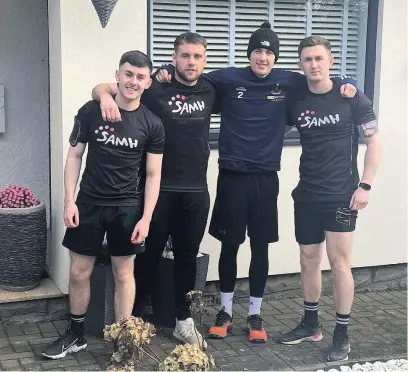  ??  ?? Running men Brothers Arran (left) and Lewis (far right) Heath with Adam Shaw and friend Tom Leighton after the two-day challenge which collected more than £2000 for SAMH