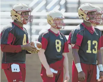  ?? STAFF FILE PHOTO BY NANCY LANE ?? BACKUP PLAN: E.J. Perry (8) will be ready to step in for Boston College quarterbac­k Darius Wade (left) this weekend at Syracuse, in the wake of the season-ending injury to starter Anthony Brown (right).