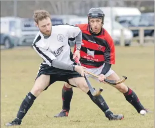  ?? Photograph: Donald Cameron. ?? Oban Camanachd’s Lorne Dickie and Glenurquha­rt’s Andrew Corrigan in action during last Saturday’s Marine Harvest Premiershi­p match at Blairbeg which ended in a 1-1 draw.