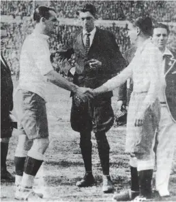  ??  ?? Belgian referee Jean Langenus oversees the hand shake between Uruguay’s captain José Nasazzi (left) and Argentina’s captain Manuel Ferreira (right) before the kickoff of the first FIFA World Cup Final on 30th July 1930 at the Estadio Centenario in...