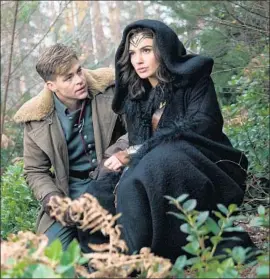  ?? Clay Enos Warner Bros. ?? “WONDER WOMAN’S” Chris Pine and Gal Gadot share sometimes touching, sometimes screwball rapport in director Patty Jenkins’ World War I-set film.