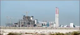  ?? KAMRAN JEBREILI/AP ?? Constructi­on of the coal-powered Hassyan plant in Dubai will cost $3.4 billion.