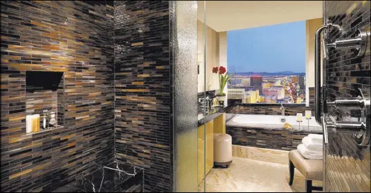  ??  ?? The three-bedroom penthouse at Trump Internatio­nal Las Vegas has views of the Las Vegas Strip.