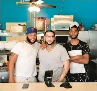  ?? ?? Brothers Kartel Jones (left) and Joseph Delgado (center) pose with their nephew, Daykwan Halls, inside their newly opened eatery, The Kartel Chicken Spot, at 432 W. Broad St. in Bethlehem.