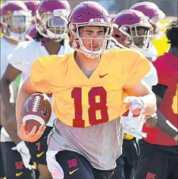  ?? Brian Rothmuller Associated Press ?? JT DANIELS, a pure pocket passer with a presence and command rare for an 18-year-old, will become the second true freshman to start the opener at quarterbac­k for USC. Matt Barkley got the start in 2009.
