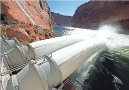  ?? ROB SCHUMACHER/THE REPUBLIC ?? A five-day high-flow experiment­al release from Glen Canyon Dam hoped to help restore the Grand Canyon’s ecosystem Nov. 19, 2012.