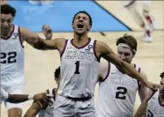  ?? Associated Press ?? Gonzaga hero Jalen Suggs celebrates with his teammates.