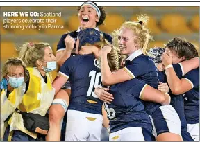  ?? ?? HERE WE GO: Scotland players celebrate their stunning victory in Parma