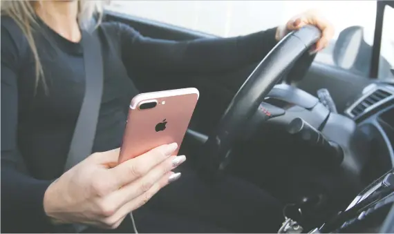  ?? JIM WELLS/DRIVING ?? A distracted driver with a G1 or G2 licence in Ontario convicted of distracted driving will get a 30-day suspension, a $615 fine and three demerits points against them.