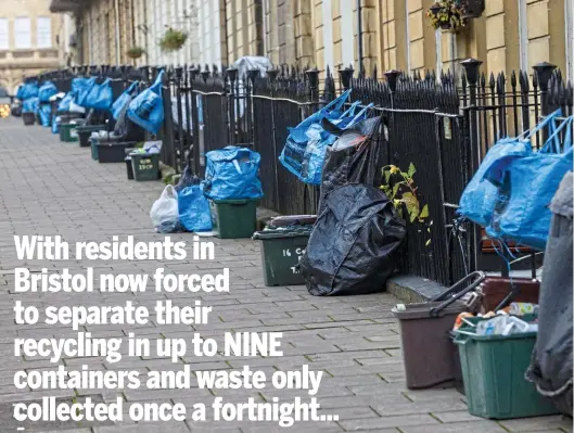  ?? ?? Unsightly: Caddies, crates and bulging bags litter the street in Clifton, Bristol