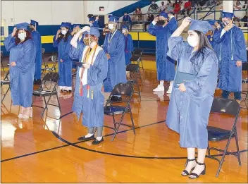  ?? Westside Eagle Observer/MIKE ECKELS ?? After the presentati­on of the diplomas, the Class of 2020 moves its tassels from left to right, indicating they are now graduates of Decatur High School.
