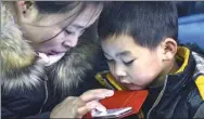  ?? HAN CHUANHAO / XINHUA ?? A woman uses instant messaging service WeChat in Hangzhou, Zhejiang province.