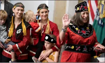  ?? BRENDAN SMIALOWSKI — AFP/GETTY IMAGES ?? Marilynn Malerba, chief of the Mohegan Tribe, stands with her family during her swearingin ceremony as U.S. treasurer in Washington on Sept. 12.