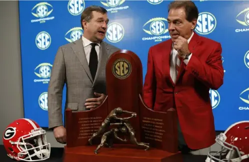  ?? Joshua L. Jones/Associated Press ?? Georgia’s Kirby Smart, left, coached under Alabama’s Nick Saban before leaving to revive the program at his alma mater.