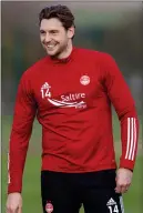  ??  ?? Dons defender Ash Taylor is ready for a physical tussle