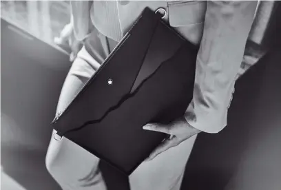  ?? ?? The Montblanc Pouch (S$1,200), made from full-grain calfskin, fits perfectly in your hand, under the arm or even when looped around the wrist.