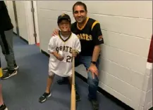  ?? Noah Hiles/Post Gazette ?? Vinay Mehta (46) and his son Toren (9) smile after giving Andrew McCutchen his 300th career home run ball at Citizens Bank Park in Philadelph­ia.