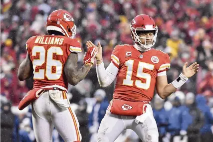  ?? JOHN SLEEZER jsleezer@kcstar.com ?? Kansas City Chiefs quarterbac­k Patrick Mahomes, right, celebratin­g with running back Damien Williams in Saturday’s win against the Colts, had the best breakout season by a young quarterbac­k since Dan Marino in 1984 as he threw for 5,097 yards and 50 touchdowns.