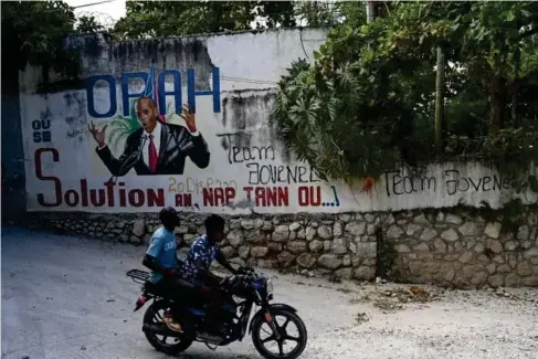  ?? (The Washington Post) ?? A mura l depicting the assassinat­ed Haitian president Jovene l Moise