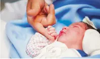  ??  ?? The birth of a baby girl to a 63-year-old woman in Dubai has started a debate on the age limit to undergo IVF treatment.