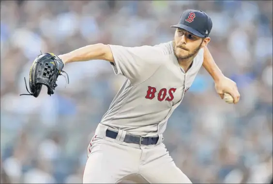  ?? Jim Mcisaac / Getty Images ?? Chris Sale of the Red Sox retired the final 16 batters he faced Saturday in the victory over the Yankees, giving Boston baseball’s best record again.