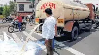  ??  ?? Farmers from Ahmednagar spill milk down a road during a state-wide protest.