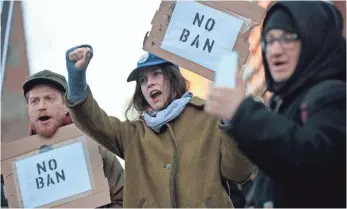  ?? DREW ANGERER, GETTY IMAGES ?? Protesters demonstrat­ed against President Trump’s revised travel ban in New York City in March. A new round of hearings begins today in federal court.