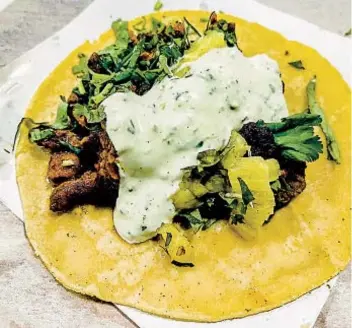  ?? ?? CARLOS RICO The Taco Stand, with five locations, puts pineapple on its tacos al pastor.
U-T