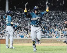  ?? ASSOCIATED PRESS FILE PHOTO ?? Milwaukee Brewers' Curtis Granderson celebrates after a home run. The ex-Toronto Blue Jay has moved around a lot, but offers experience.