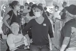  ?? CARL JUSTE cjuste@miamiheral­d.com ?? Peruvian voters wait in one of many lines to cast their vote Sunday at the Consul General of Peru in the Doubletree, Miami Airport & Convention Center in Miami.