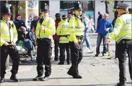  ??  ?? Greater Manchester police in ‘high-vis’ jackets