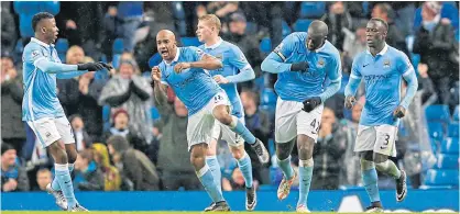  ??  ?? Yaya Toure, second right, celebrates Manchester City’s match-winning goal with teammates.