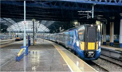  ?? PAUL BICKERDYKE ?? Together, ScotRail and the Scottish Government have opened new lines, increased electrific­ation, and introduced new trains – such as this Class 385 EMU No. 385008 seen at Glasgow Queen Street on October 29, 2021.